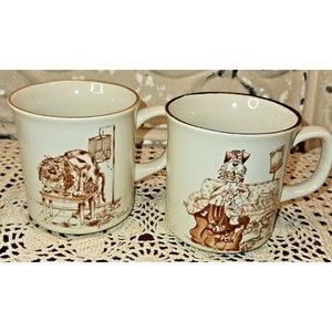 Pair of Susan Drawbaugh Coffee Mugs "The Determined"  & "The Meticulous"